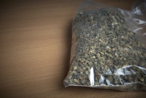 Image Of Marijuana On Desk For Drug Defense Attorney - NOLA Criminal Law