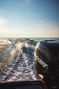 Image of boat over open water observing boater laws